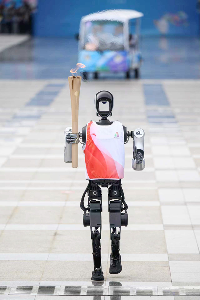 Humanoid robot torchbearer in the torch relay.jpg